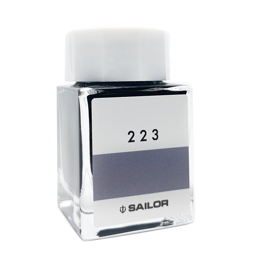 Square glass bottle of Sailor Ink Studio #223, featuring a white cap, part of a 100-color collection, showcasing customer-inspired dye-based fountain-pen ink.