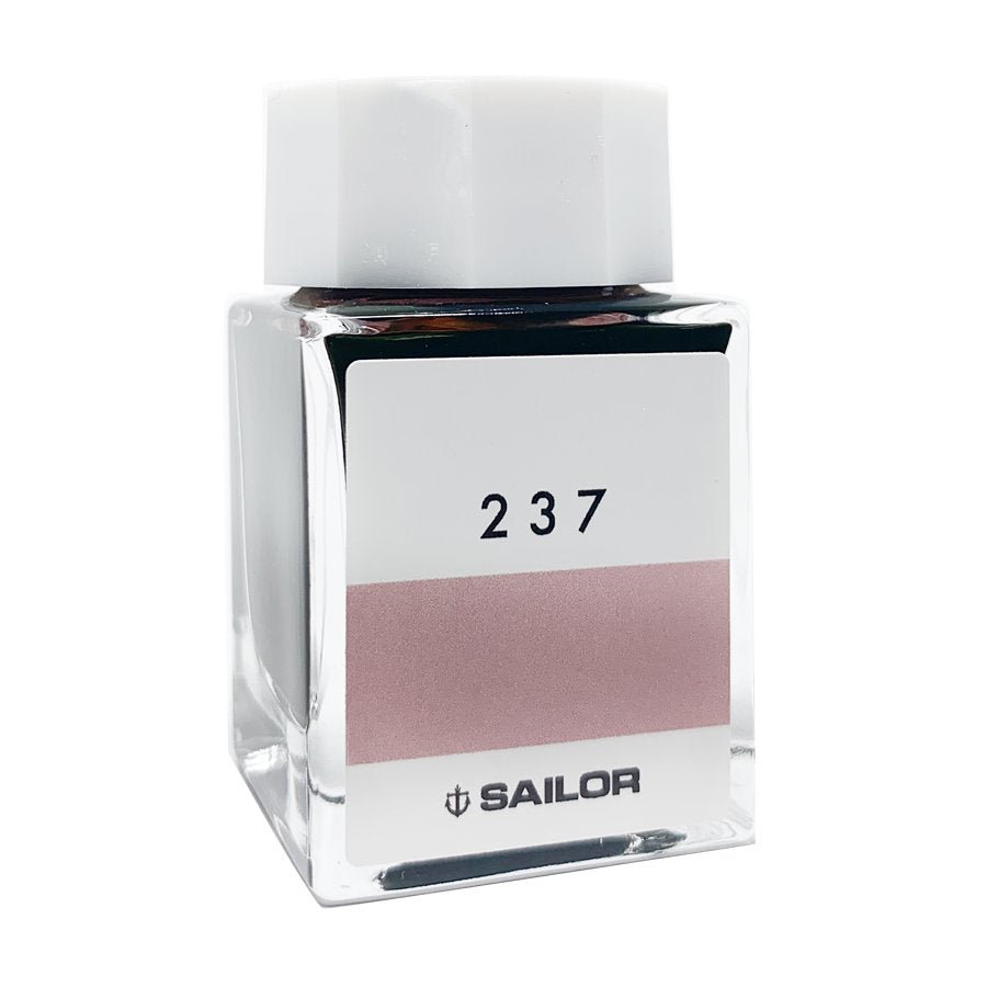 Ink Studio #237 - 20ml: A compact, square glass bottle with a white cap, containing Sailor's muted rose-toned fountain-pen ink.
