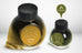 String & Brane - 65ml + 15ml Set; two Colorverse ink bottles, larger yellow-gold STRING and smaller glistening olive-green BRANE, both with faceted black caps.