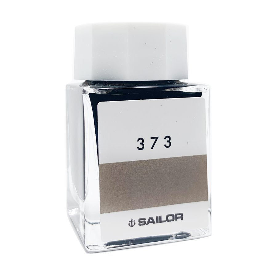 Sailor Ink Studio #373 - 20ml: Square glass bottle with a white cap and greyish-brown label. Part of a curated 100-color collection.