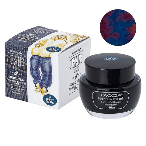 40ml bottle of Taccia's Navy Blue (Jeans) fountain pen ink with outer carton and navy-blue swatch, inspired by denim jeans, showcasing Japanese craftsmanship.