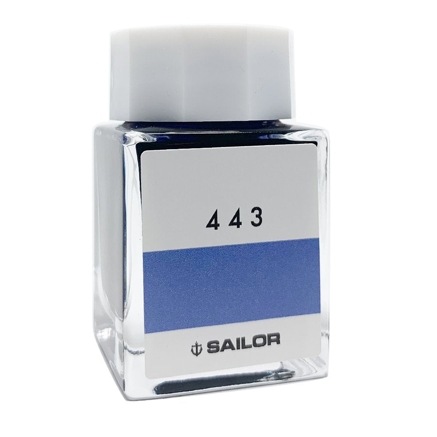 Sailor Ink Studio #443 - 20ml, a small rectangular glass bottle with a blue label and white screw-on cap, showcasing premium fountain-pen ink.