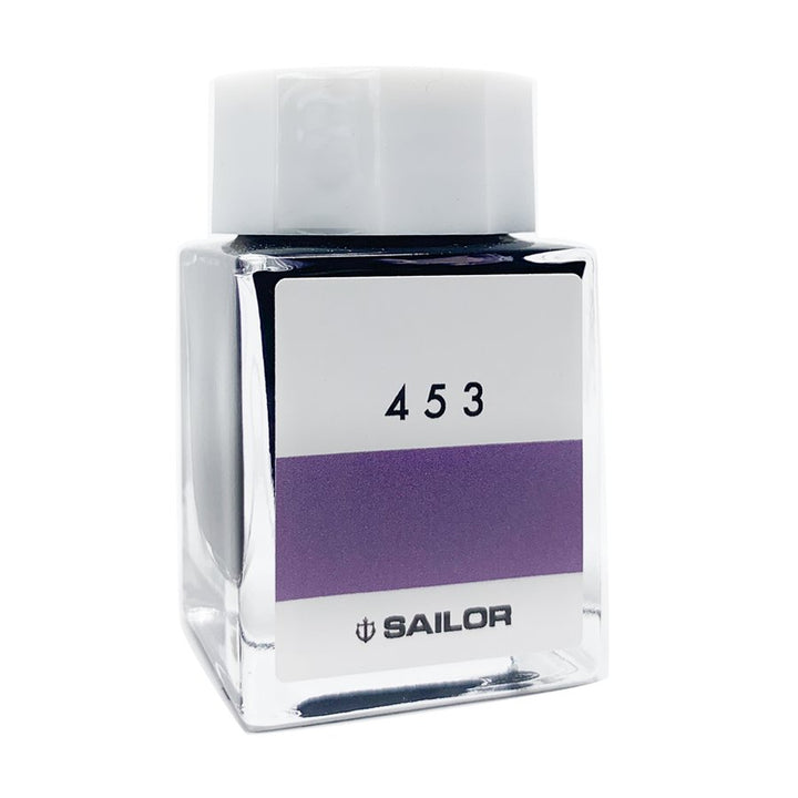Square glass bottle of Sailor Ink Studio #453 fountain-pen ink, featuring a medium purple swatch, with a white cap and label showcasing the Sailor logo.