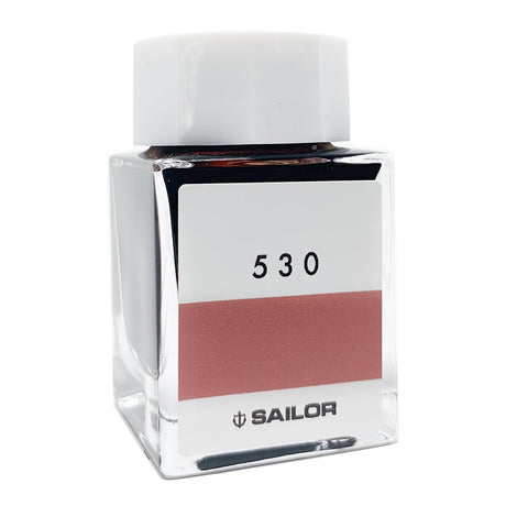 Ink Studio #530 - 20ml: Square glass bottle with white cap, featuring a reddish-rose ink swatch on the front. Part of Sailor's curated 100-color collection.