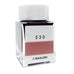 Ink Studio #530 - 20ml: Square glass bottle with white cap, featuring a reddish-rose ink swatch on the front. Part of Sailor's curated 100-color collection.