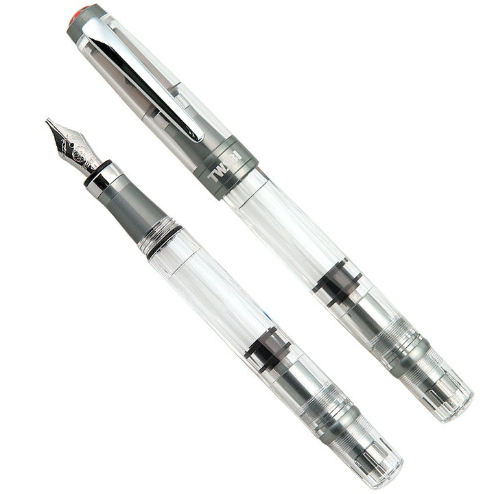 Diamond 580 ALR (Nickel Gray) - Medium: Two clear-body fountain pens, one uncapped showing the nib, with silver-tone trim and matte detailing on grip and cap.
