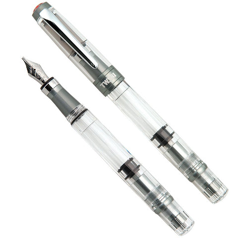 Diamond 580 ALR (Nickel Gray) - Stub 1.1 fountain pen, showcasing a clear body with a stainless-steel nib, capped and uncapped views highlighting its aluminum grip and piston-filler mechanism.