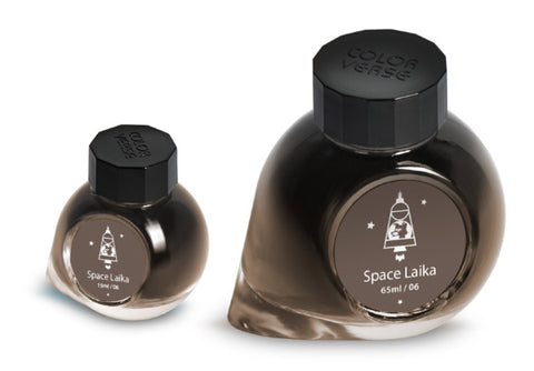 Space Laika - 65ml + 15ml Set: Two glass ink bottles featuring a space dog motif from Colorverse's Spaceward Collection, highlighting quality plant-based fountain-pen inks.