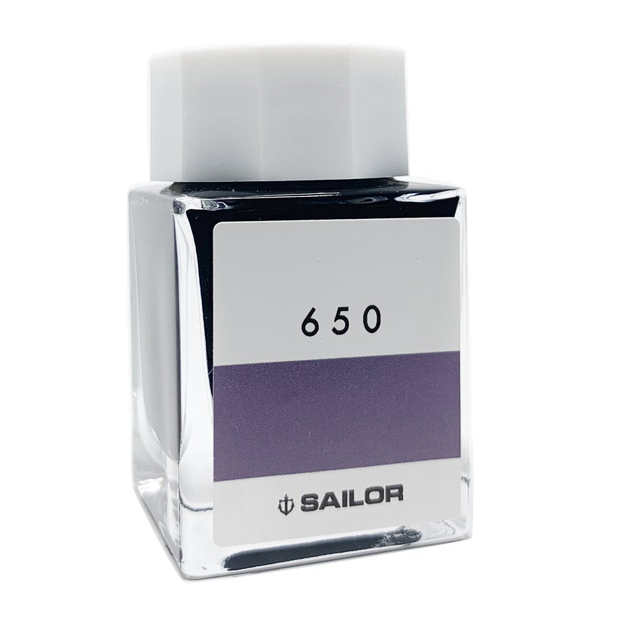 Square glass bottle of Sailor Ink Studio #650, featuring a screw-on white cap and 650 label over a purple swatch with Sailor's anchor logo.