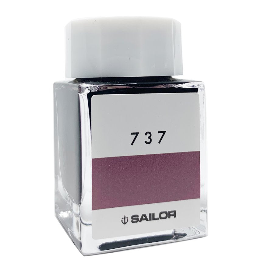 Square glass bottle of Sailor Ink Studio #737, featuring a dusty-rose swatch, with a white cap; contains 2ml of dye-based fountain-pen ink.