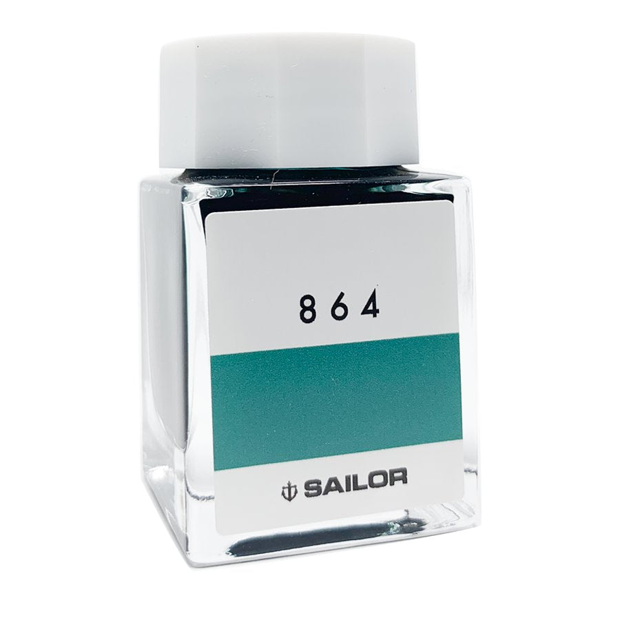 Sailor Ink Studio #864, 20ml square glass bottle, features the anchor logo. This discontinued teal/green fountain-pen ink is compact and elegantly designed.