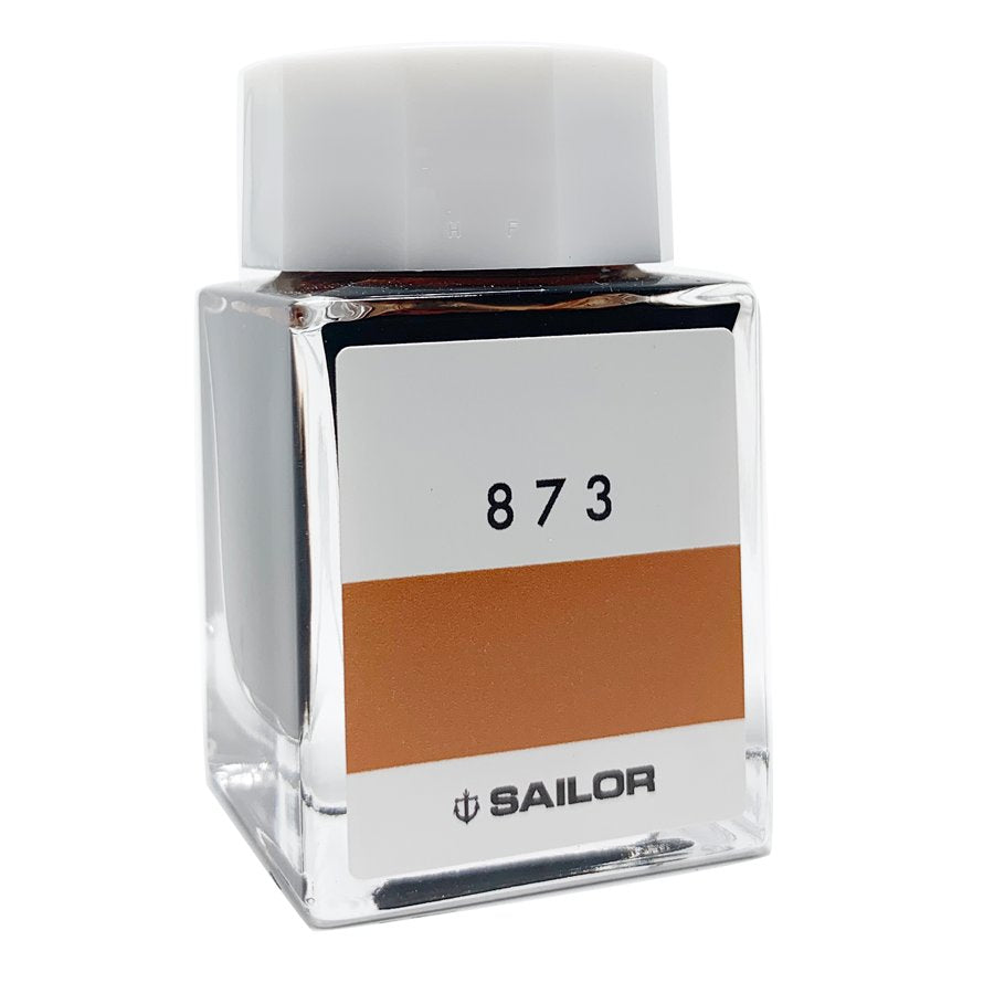 Sailor Ink Studio #873 - 20ml: Square glass bottle with white cap, featuring an orange-brown ink swatch on the label. Part of Sailor's curated 100-color collection.