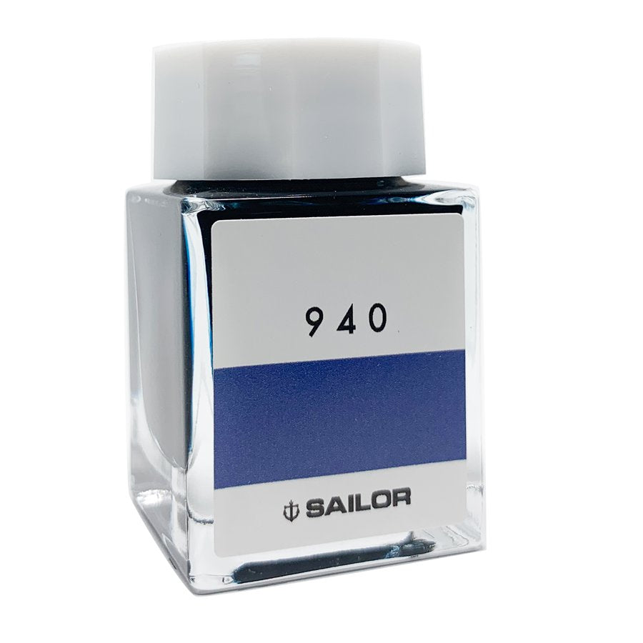 Square glass bottle of Sailor Ink Studio #940, featuring a prominent 940 label and blue band, contains 2ml of dye-based fountain-pen ink.