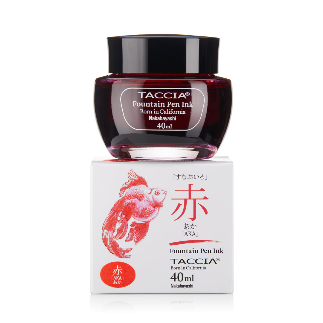 A 40ml glass jar of Taccia Aka fountain-pen ink on a matching box, featuring a goldfish illustration and kanji for “red.”