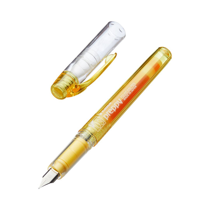 Preppy - Fine (Yellow) fountain pen with translucent-yellow body, exposed steel nib, and visible ink cartridge, cap removed. Features a slip & seal mechanism for ink preservation.