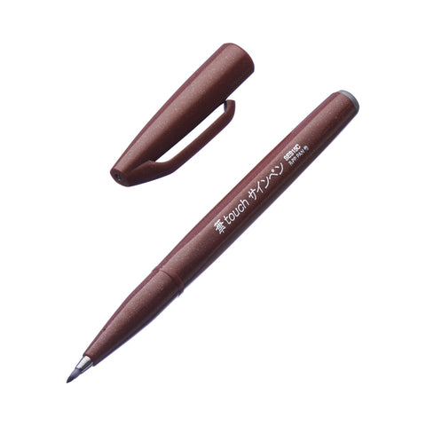 Fude Touch Brush Sign Pen - Brown with a fine nib, ideal for calligraphy and illustrations, shown uncapped on a white background.