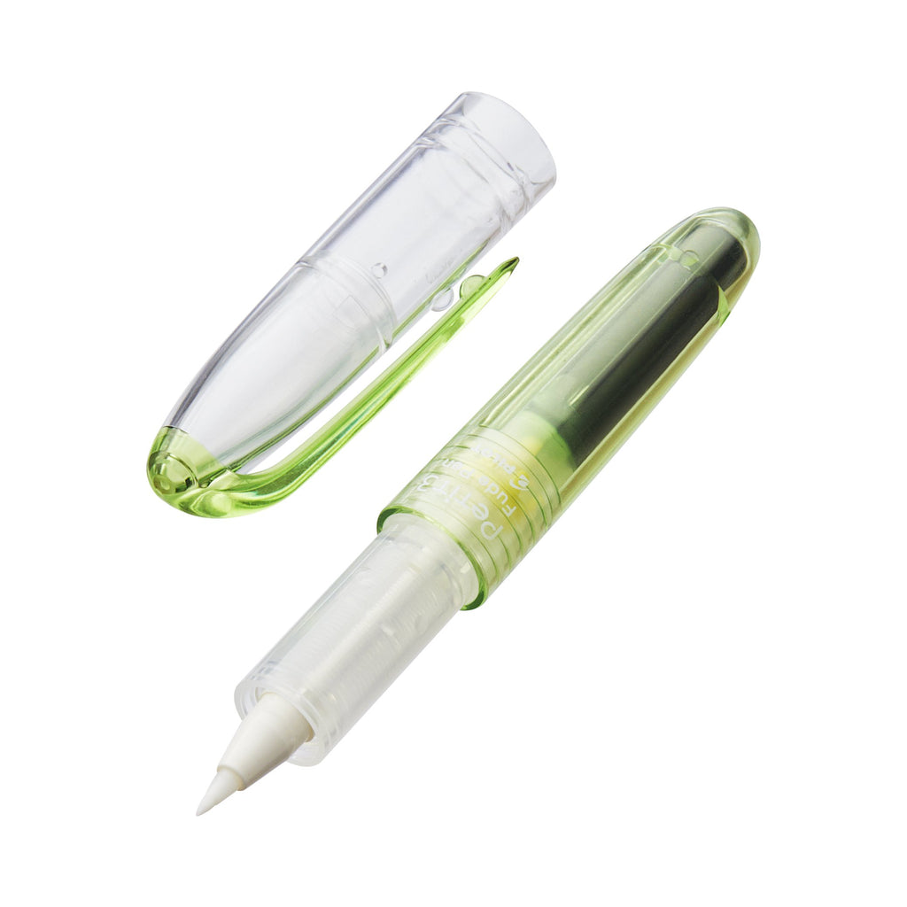 Petit3 Mini Fude Brush Pen - Green with a translucent barrel and fine brush felt tip, shown with cap removed, highlighting its portable design.