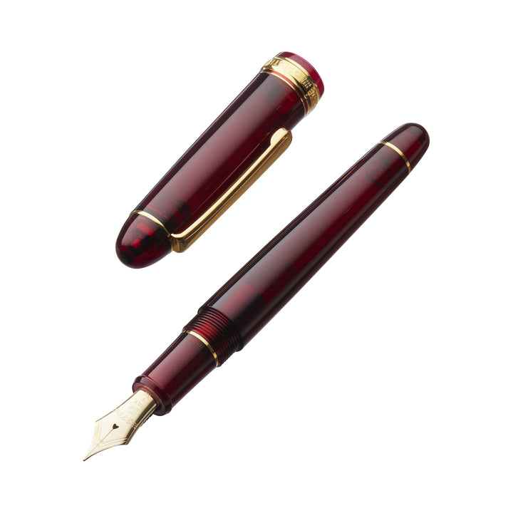 Platinum 3776 Century Bourgogne fountain pen features a burgundy resin body with gold trim, 14k gold broad nib, and includes a protective case.