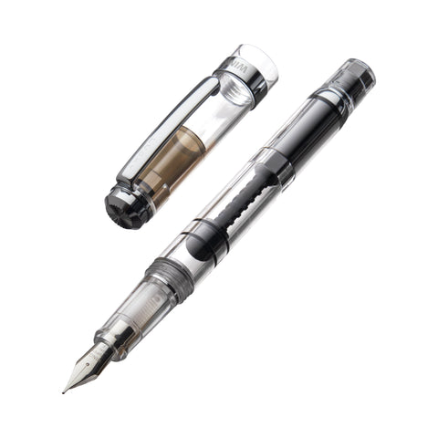Wing Sung 698 (Clear/Silver) - Fine fountain pen, uncapped, displaying its fine nib and internal piston-style ink reservoir for easy maintenance and cleaning.