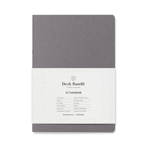 Tomoe River Notebook - A5 (Dot Grid) with grey cardstock cover, in paper sleeve, contains 64 pages of fountain-pen-friendly dot-grid paper, ideal for journaling.