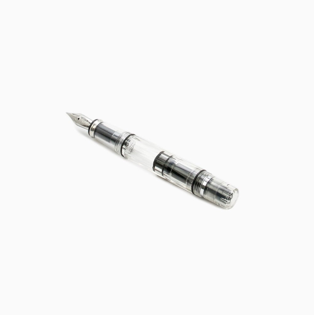 Diamond Mini (Clear) - Stub 1.5 fountain pen with transparent body, exposing piston-filling mechanism, metal nib, and black feed, perfect for on-the-go use.