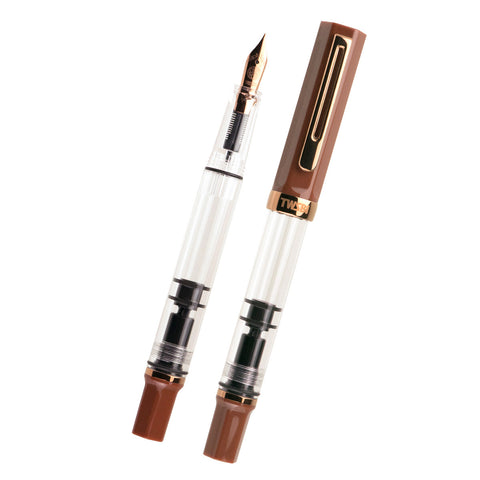 TWSBI ECO (Espresso/Bronze) - Extra Fine fountain pens showing clear barrels, one uncapped to display the nib and piston-filling mechanism, with brown caps and gold trim.