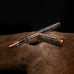 TWSBI ECO fountain pen in Serpentine colourway with copper accents, displayed on a natural wooden surface