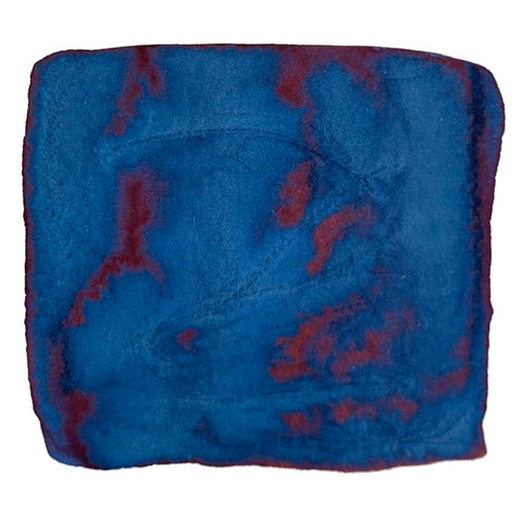 Gray Navy (Jeans) - 2ml ink sample shows a cobalt-blue wash with rusty red patches, reflecting Taccia's denim-inspired color, reminiscent of watercolor art.