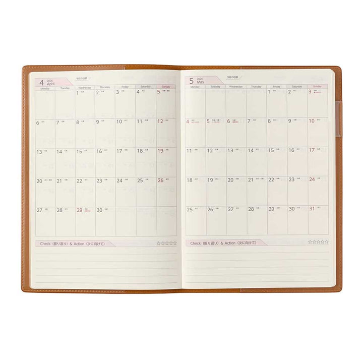 2026 PDCA Planner - A5 (Camel): Open leather-style planner showing April and May 2026, with daily squares and a Check & Action section in English and Japanese.