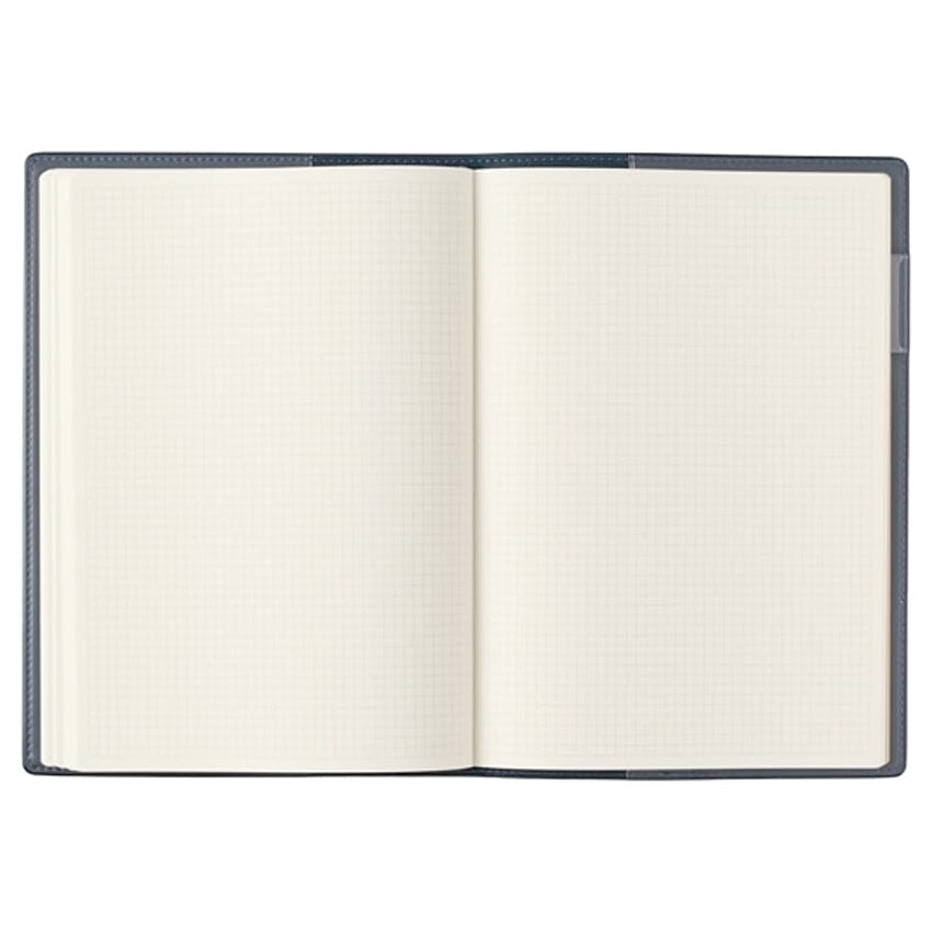 2026 Nolty PDCA Planner - A5 (Navy), open to show blank grid paper, ideal for fountain pen use. Features include leatherette cover, pen holder, and Japan Rail map.