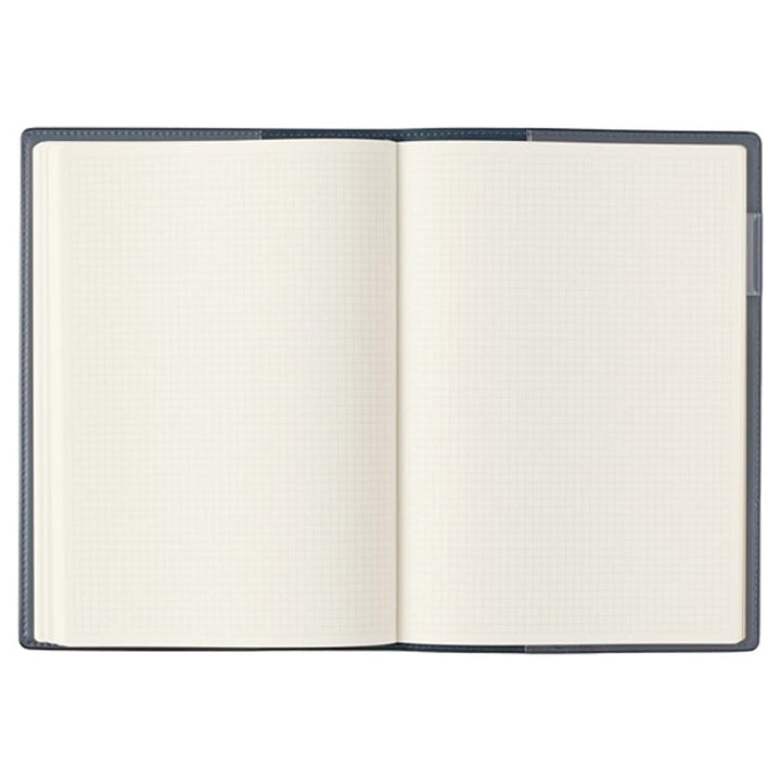 2026 Nolty PDCA Planner - A5 (Navy), open to show blank grid paper, ideal for fountain pen use. Features include leatherette cover, pen holder, and Japan Rail map.
