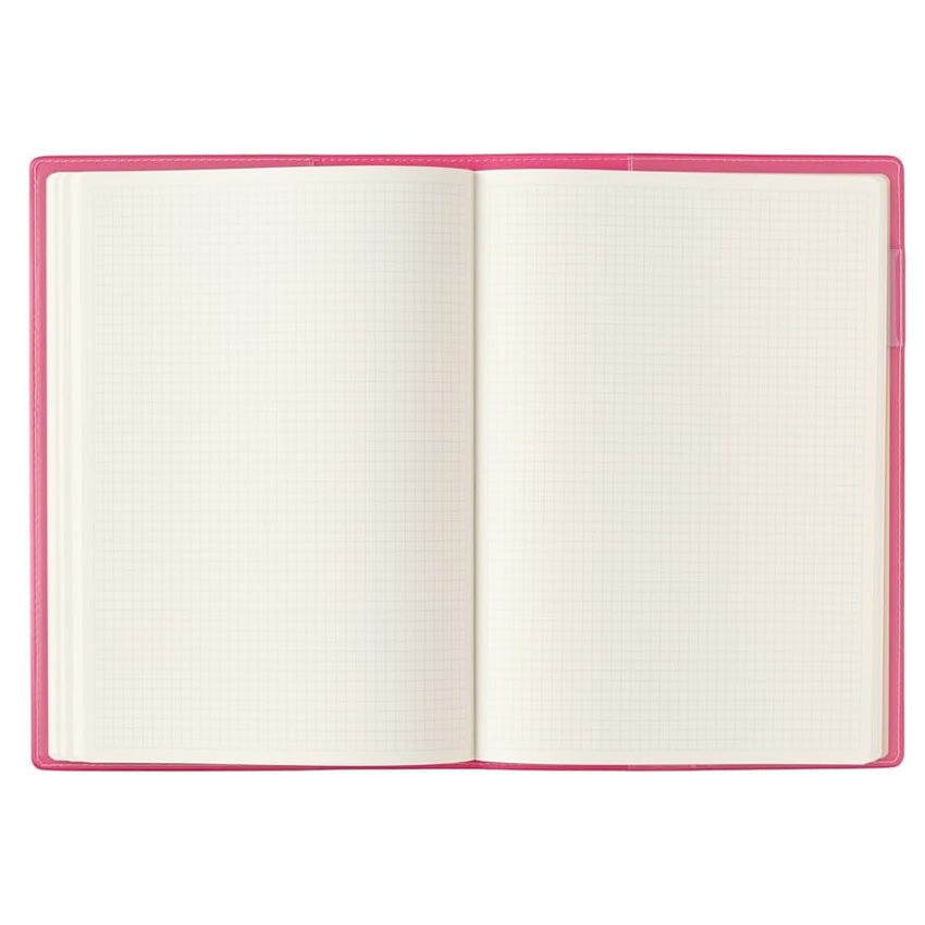2026 Nolty PDCA Planner - A5 (Pink) with a blank grid-patterned page open, showcasing its Japanese craftsmanship and detailed design, ideal for fountain pen note-taking.