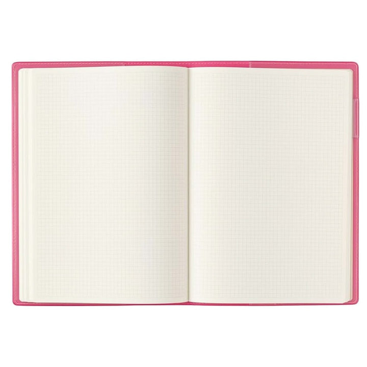 2026 Nolty PDCA Planner - A5 (Pink) with a blank grid-patterned page open, showcasing its Japanese craftsmanship and detailed design, ideal for fountain pen note-taking.