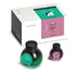 Arabella & Anita - 65ml + 15ml Set with green-teal and magenta-purple inks, boxed with brochure, pen rest, stickers, bookmark, and napkin.