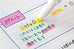 Close-up of a chemistry notebook page with a Justfit Mojini Line Highlighter - Blue, highlighting chemical formulas and notes with precision, showcasing its anti-smudge capability.
