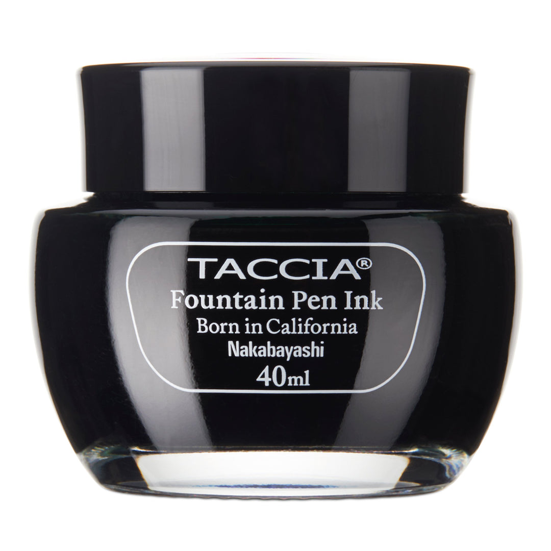 Taccia Uguisu - 40ml glass bottle of fountain pen ink, labeled “Born in California,” featuring a standard black ink by Nakabayashi, inspired by Japanese color perception.
