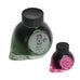 Colorverse Able - 2ml sample features two fountain-pen ink bottles: 65ml Able with octagonal cap, swirled base, and 15ml Miss Baker.