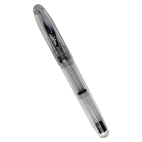 Ahab Flex - Clear Demonstrator: Transparent fountain pen with clear acrylic barrel, metal cap, and flexible steel nib, showing piston-filling mechanism inside.