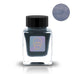 AO•I (Shimmer) - 2ml ink sample in a square glass jar with a black cap and cartoon-face label, showcasing deep shimmery blue ink.