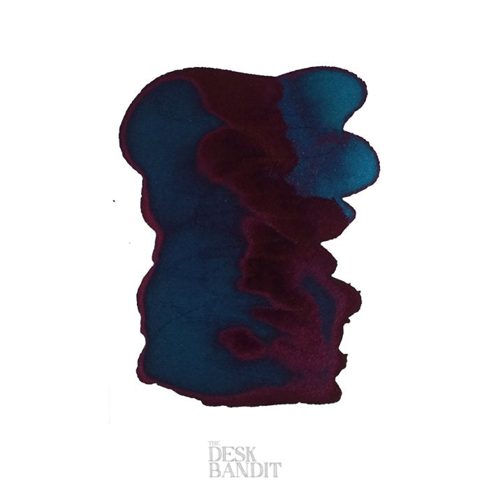 Aqua - 2ml ink sample by Robert Oster, showcasing a teal center with burgundy edges and shimmer, on a paper with THE DESK BANDIT watermark.