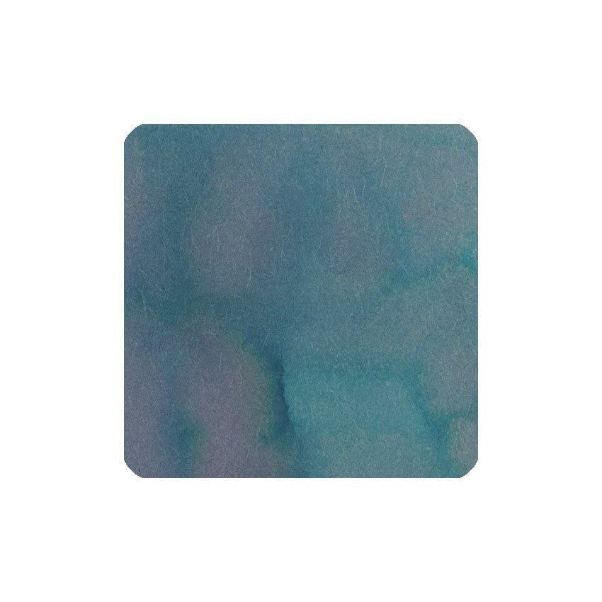 Attending the Lamp - 20ml bottled fountain pen ink by Fanyantan, showcasing a textured blend of muted teals and blue-greens, perfect for artistic writing.