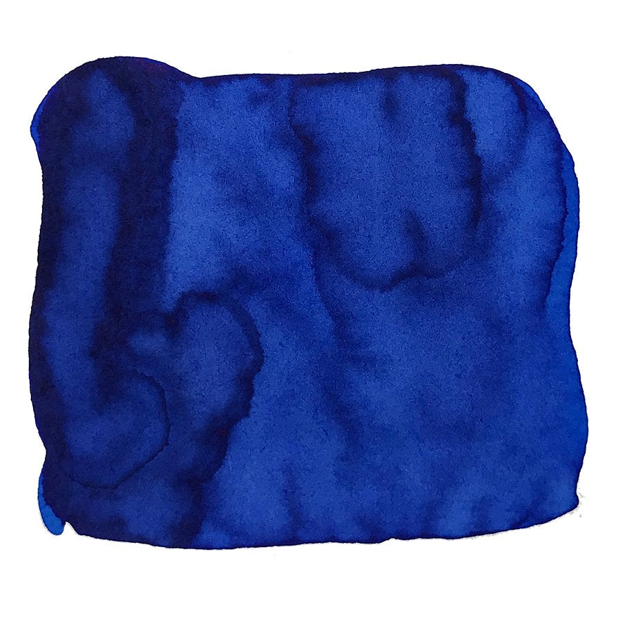 Abstract swatch of Brevity Blue ink, showcasing its deep hue with soft, uneven edges, representing Noodler's Ink's dye-based, quick-dry formula in a 2ml bottle.