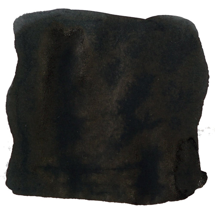 Brevity Black - 2ml: A swatch of deep black, fuzzy fabric, resembling felt, displayed against a white background, representing the ink's rich, dark hue.
