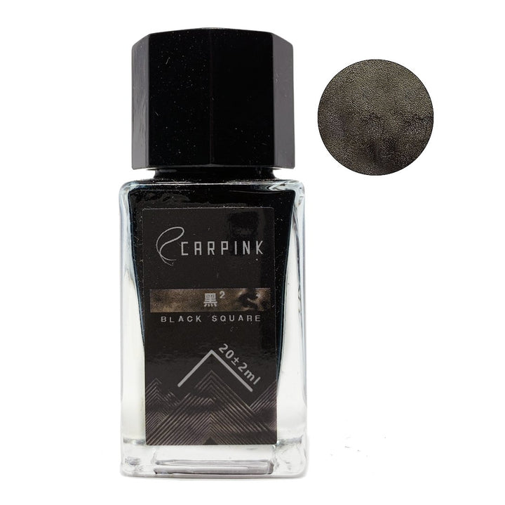 Carpink Black Square 18ml fountain-pen ink in a small glass bottle, featuring jet-black color with a dark silver sheen, alongside a round color swatch.