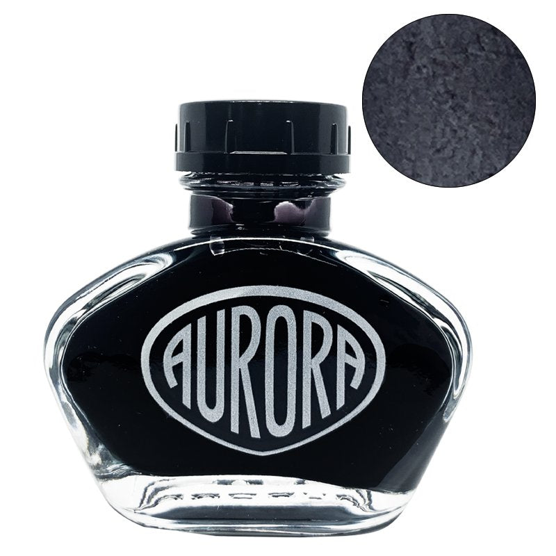 Aurora 100th Anniversary - Black (2ml) ink bottle, showcasing deep black dye-based ink. Close-up swatch reveals rich, nearly jet-black color.
