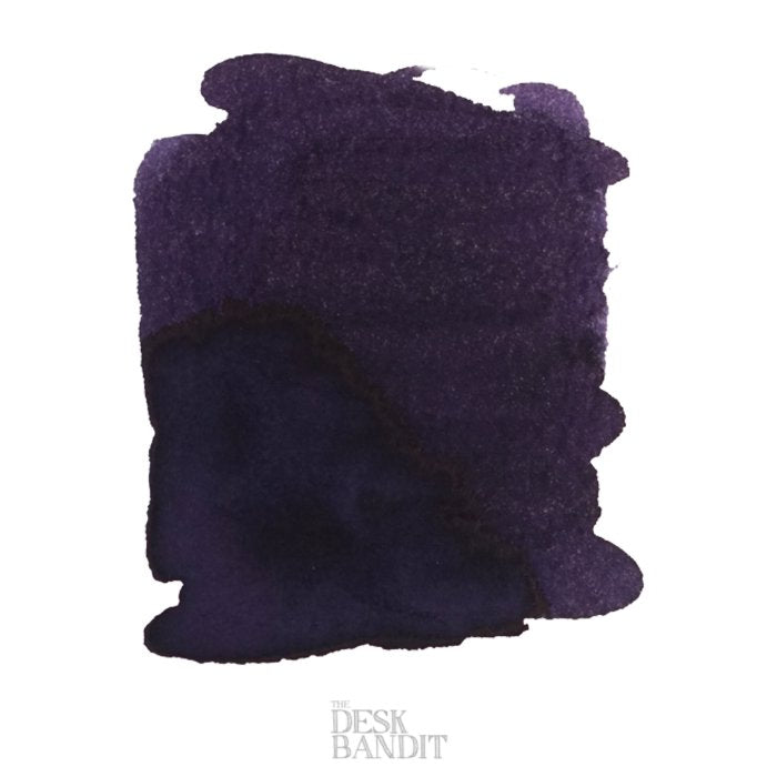 Black Violet - 50ml ink swatch, showcasing deep purple tones with granulation. THE DESK BANDIT watermark indicates a sample for fountain pen enthusiasts.