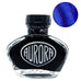 Aurora 100th Anniversary - Blue (55ml) ink bottle with clear glass body, black cap, silver logo, and a deep blue swatch with a reddish sheen.