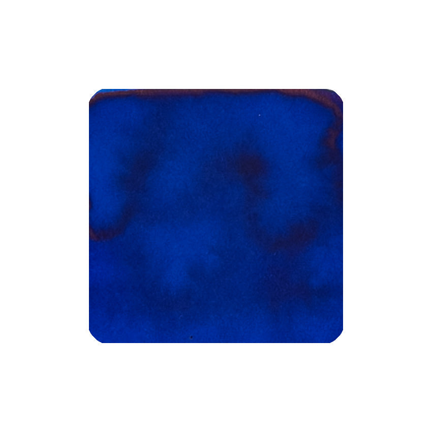 Blue Velvet (150th Anniversary) fountain pen ink, 40ml, displays a deep blue watercolor texture with reddish hints, celebrating Diamine's heritage in a unique triangular bottle.