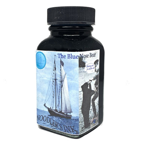 Square glass bottle of Noodler's Ink, labeled Blue Nose Bear - 88ml, showcasing turquoise dye-based ink known for its fraud resistance and UV fluorescence.