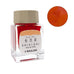 Sailor’s Shikiori Kin-mokusei - 20ml glass bottle with ink swatch, showcasing warm orange-reddish dye-based ink, part of the Four Seasons Series.